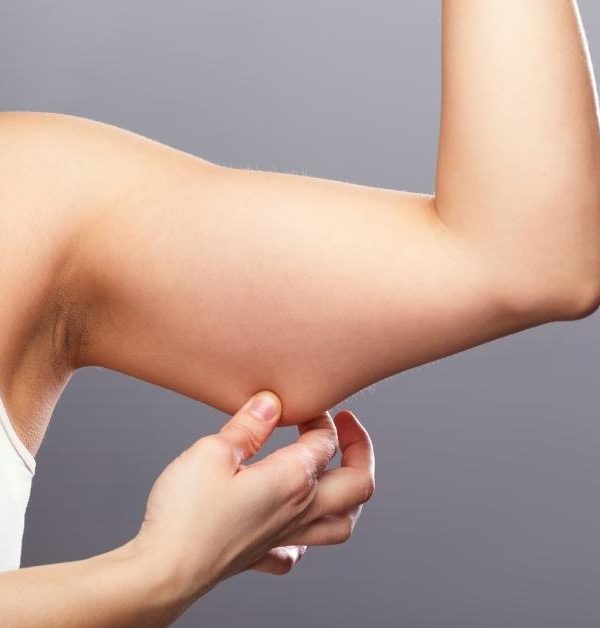 Woman holding her arm fat